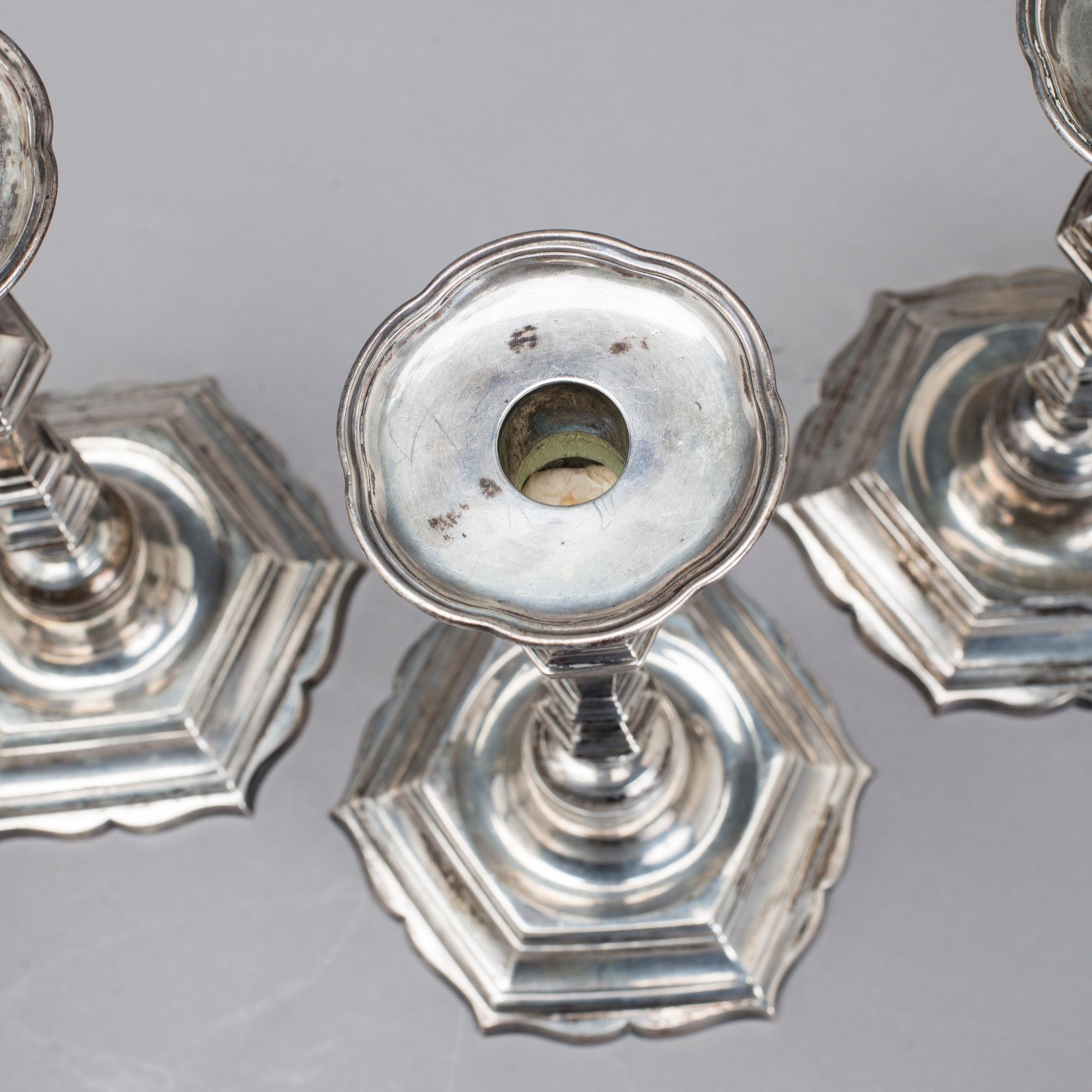 Two simular pairs of candlesticks, two marked Barde, Geneve 18th century, two with later marks.