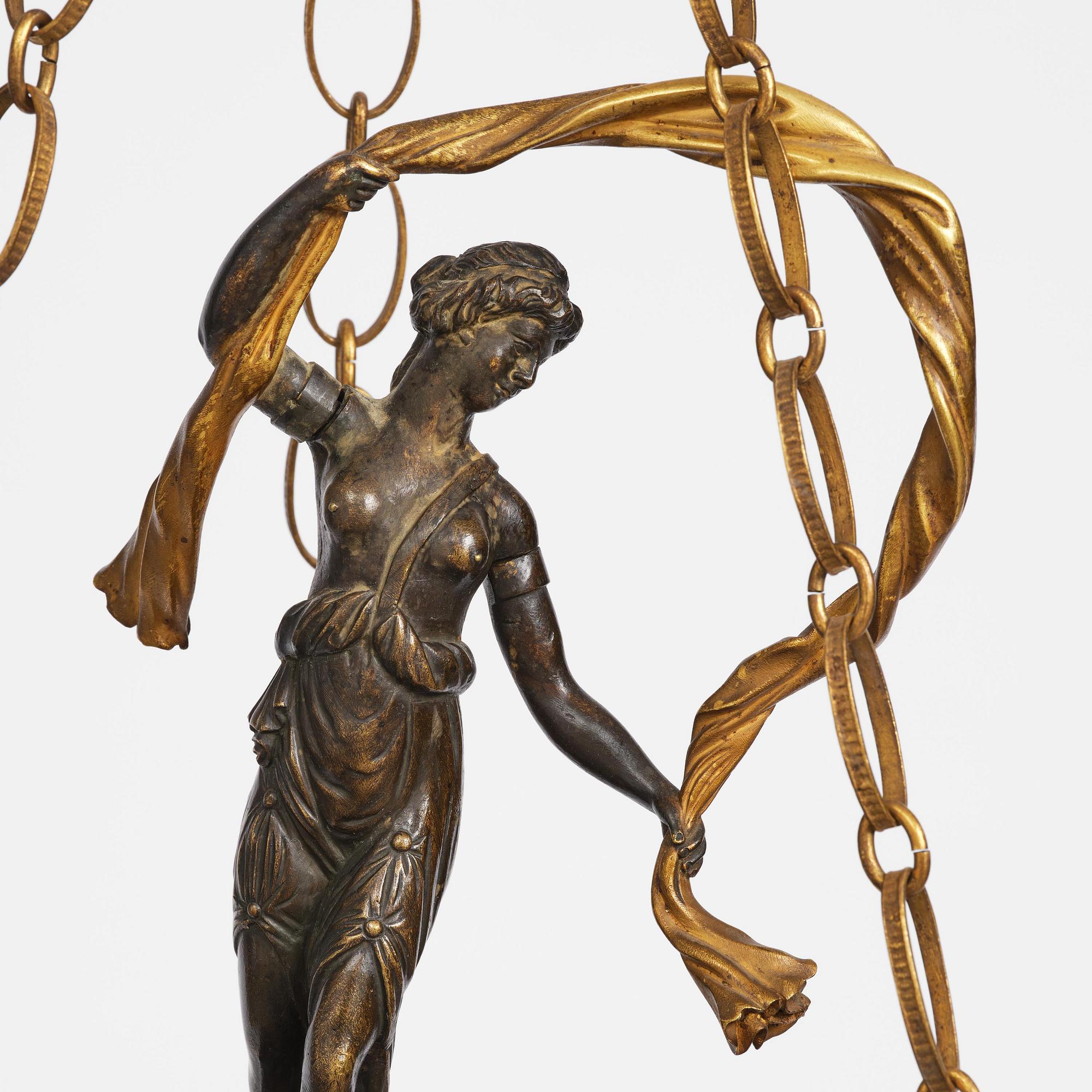 A patinated and ormolu six-light Empire chandelier, Stockholm, first part 19th century.