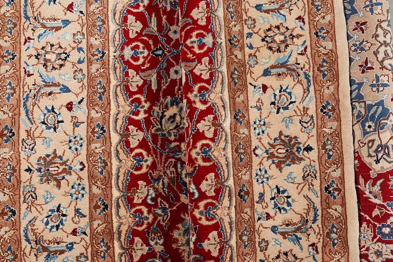 A carpet, Nain, part silk, 9 Laa, ca 295 x 178 cm.