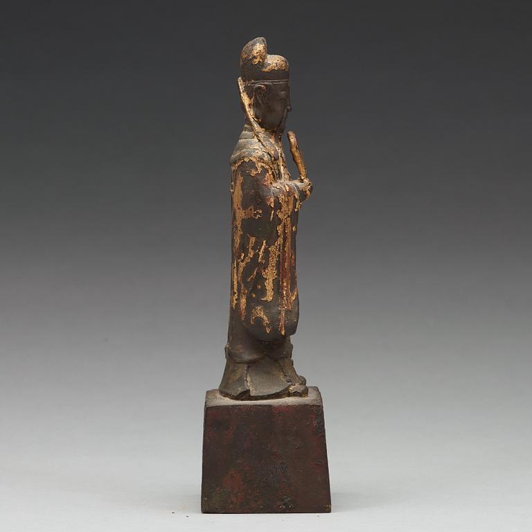 A copper alloy figure of a daoist dignitary, late Ming dynasty (1368-1644).