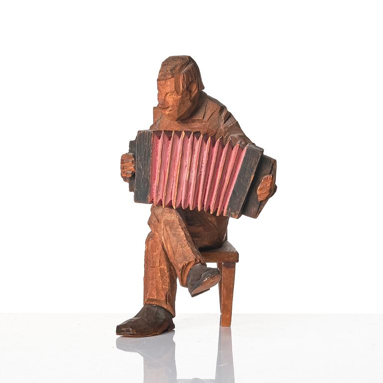 Axel Petersson Döderhultarn, Seated accordionist.