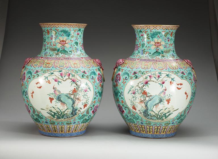A large pair of turquoise ground famille rose vases, early 20th Century with Qianlongs sealmark.