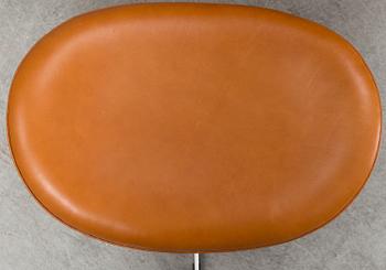 ARNE JACOBSEN, an 'Egg' anilin leather lounge chair and ottoman Fritz Hansen, Denmark, 2019.