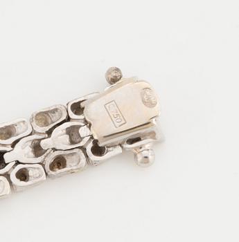 A fancy-link bracelet.