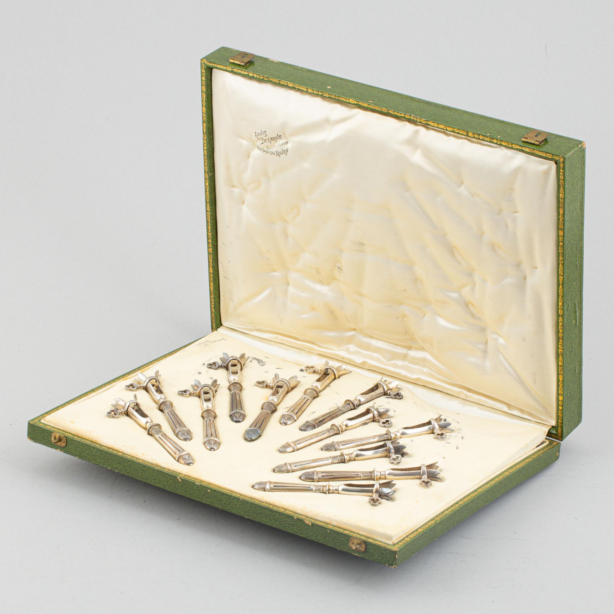 A set of six French silver pork chop holders, circa 1900.