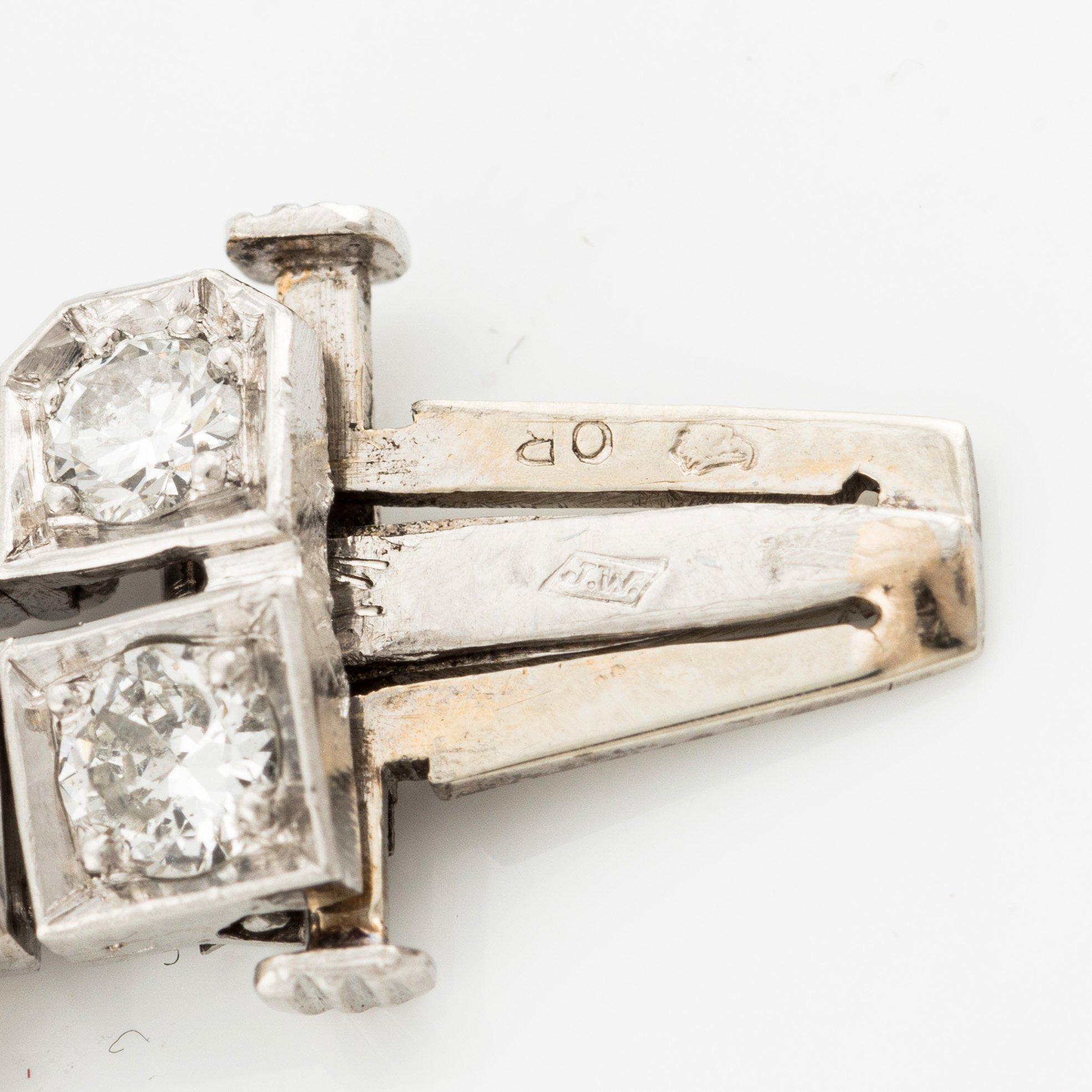 Armband platina med runda briljant, åttkant- och baguetteslipade diamanter, Gübelin.