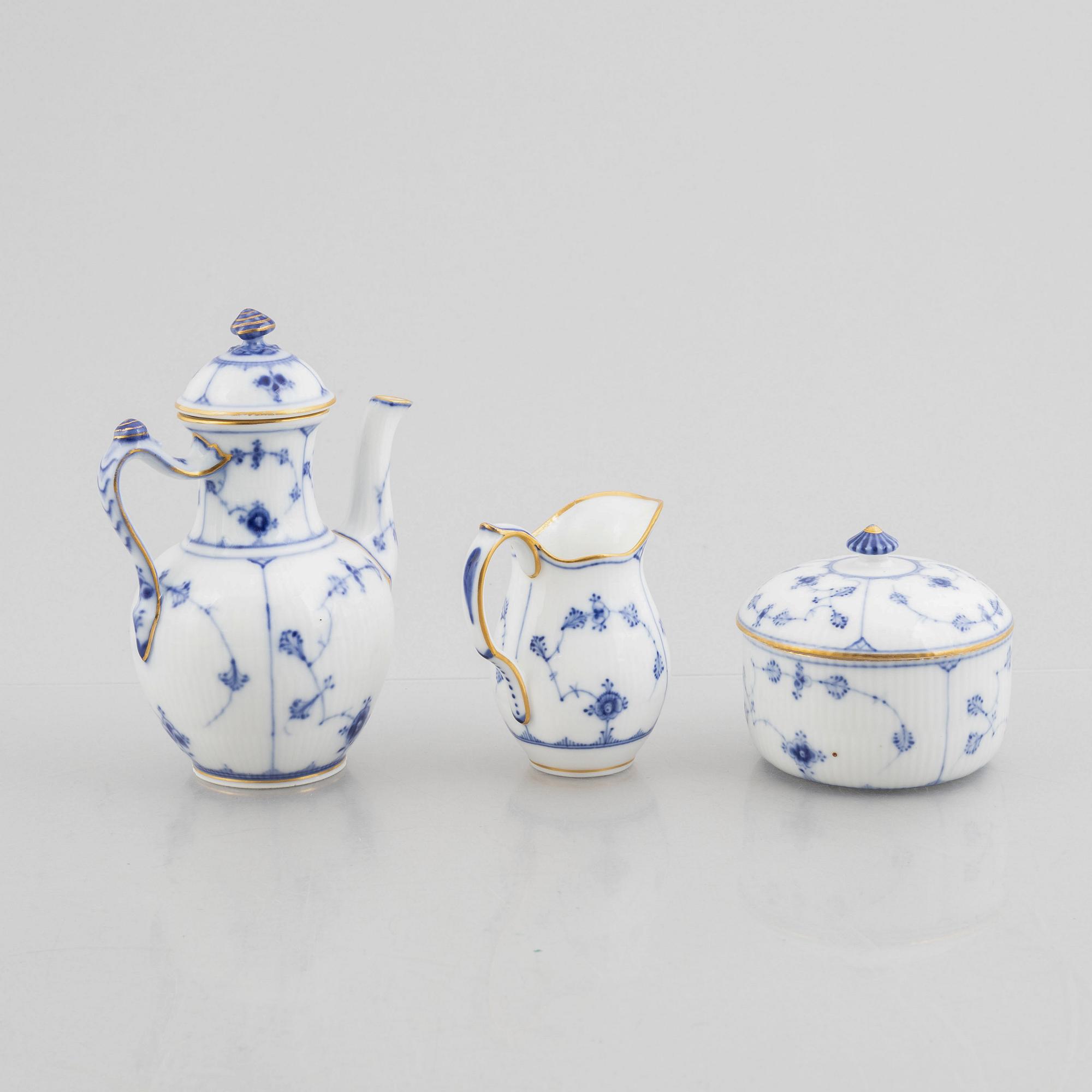 A "Blue fluted"/"Musselmalet riflet" porcelain mocha pot, a sugar box with cover and a creamer, Royal Copenhagen, 19th c.