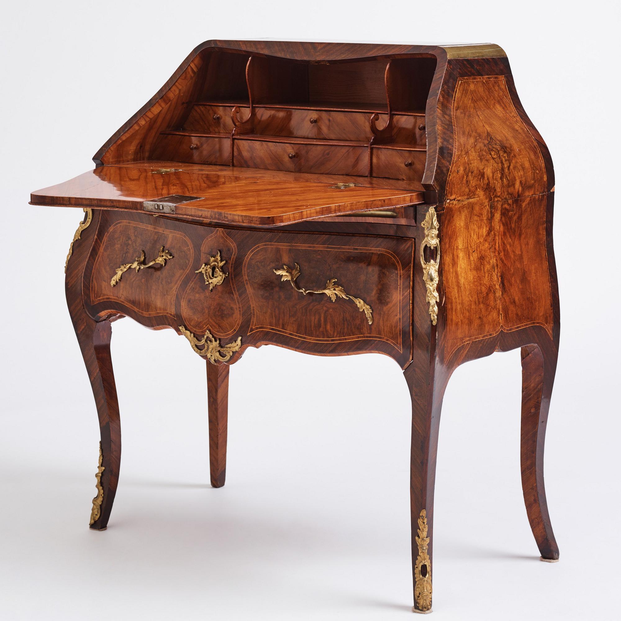 A rosewood, walnut, and gilt brass-mounted rococo secretaire by J. H. Reimers (master in Stockholm 1754-73).