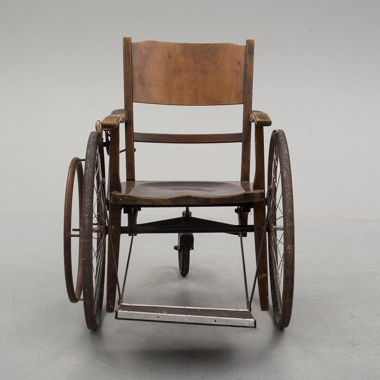 An early 20th century wheel chair.