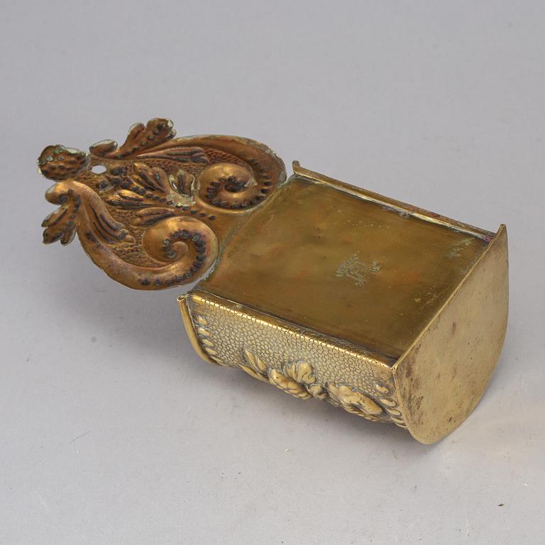 A 19th century brass spoon holder.