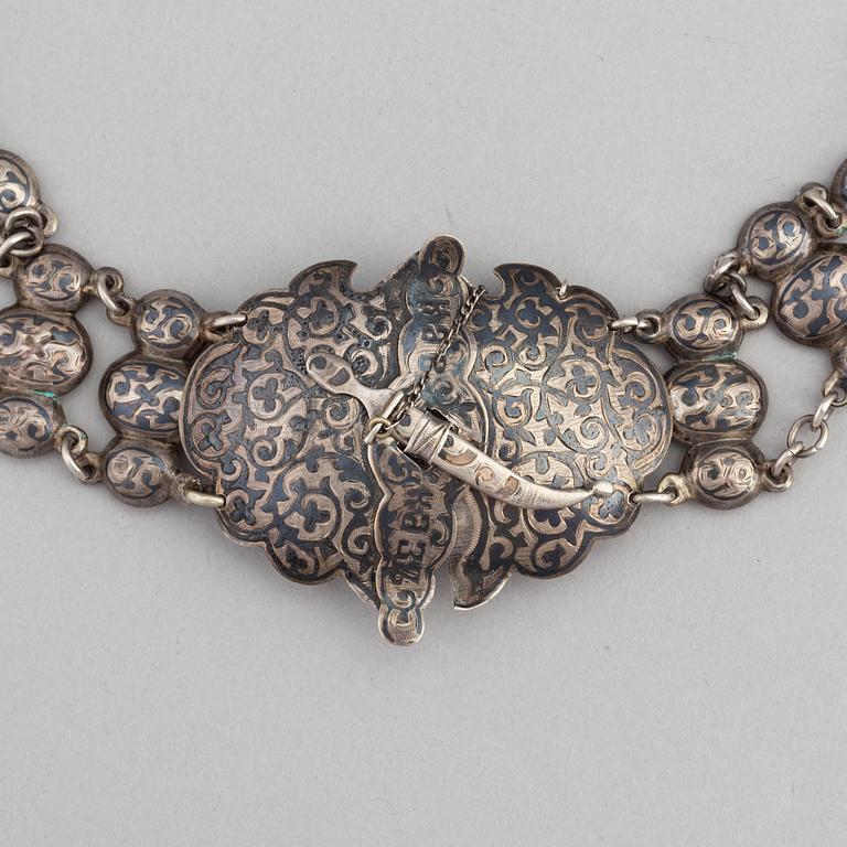 A Russian silver niello belt, circa 1900. Swedish import mark.