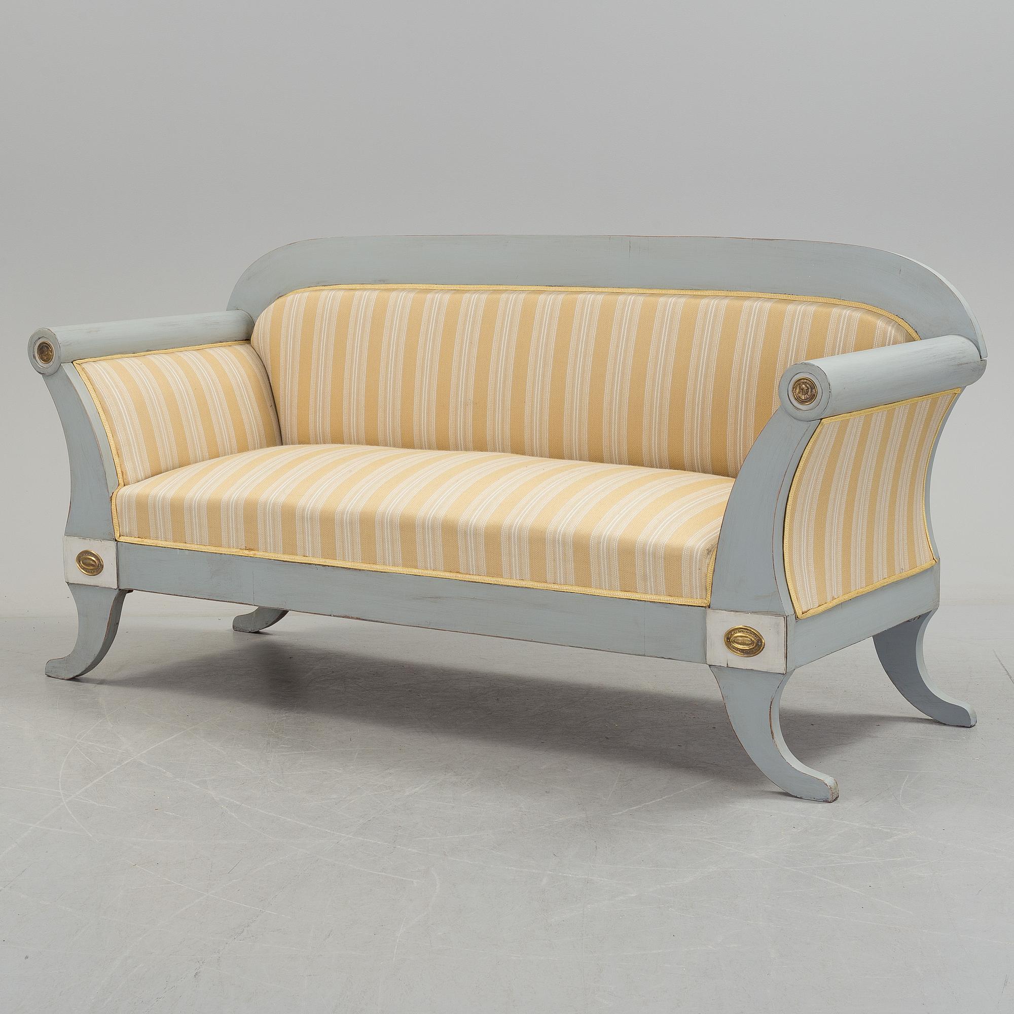 A mid 19th century painted sofa.
