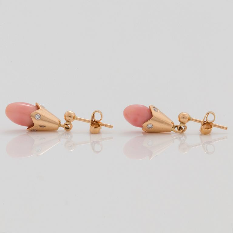 A pair of natural conchpearl and diamond earrings.