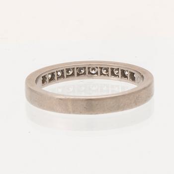 An 18K white gold half eternity ring set with round brilliant-cut diamonds.