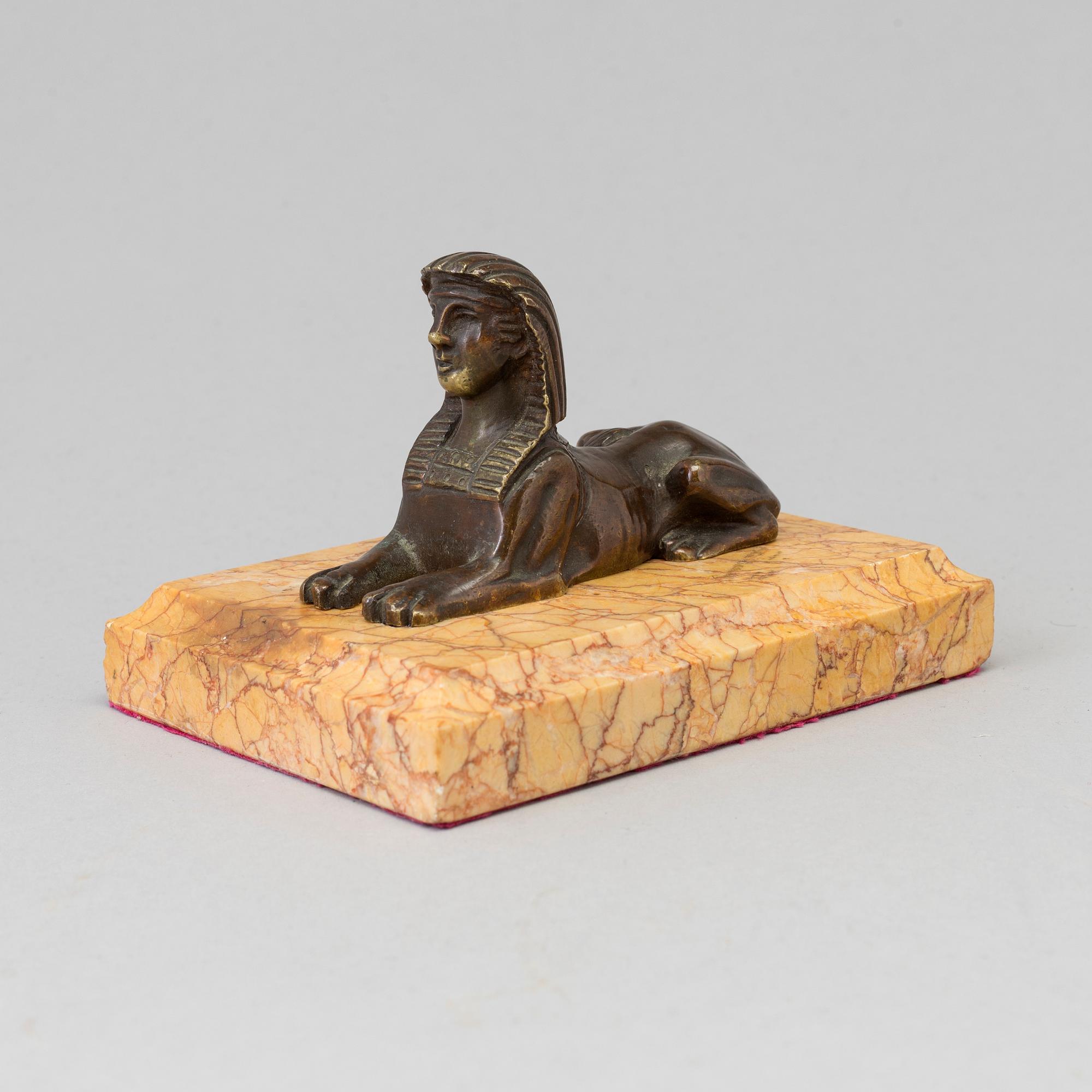 AN EMPIRE  BRONZE AND MARBLE PAPER WEIGHT, early 19th century.