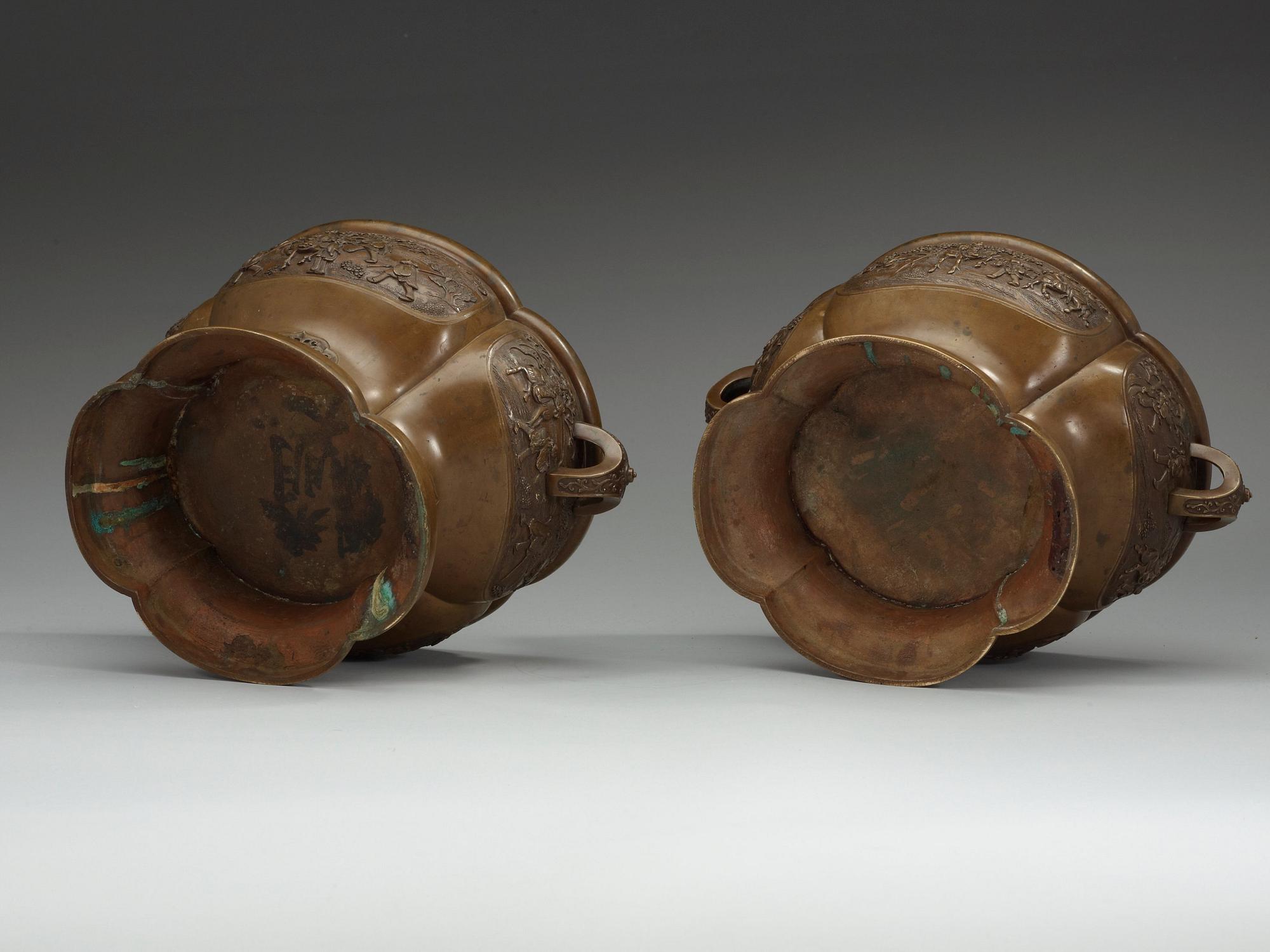A pair of bronze flower pots, Qing dynasty, with Xuande six character mark to the interior.