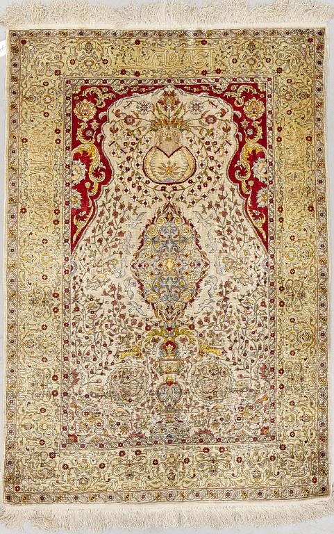 A rug, Old silk Hereke, ca 178 x 119 cm.