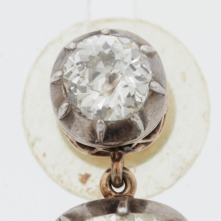 A PAIR OF EARRINGS set with four old-cut diamonds.