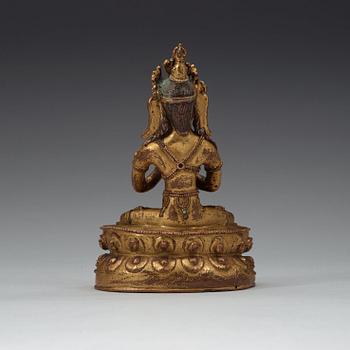 A gilt copper alloy figure of Vajradhara, possibly Tibet, 15/16th Century.