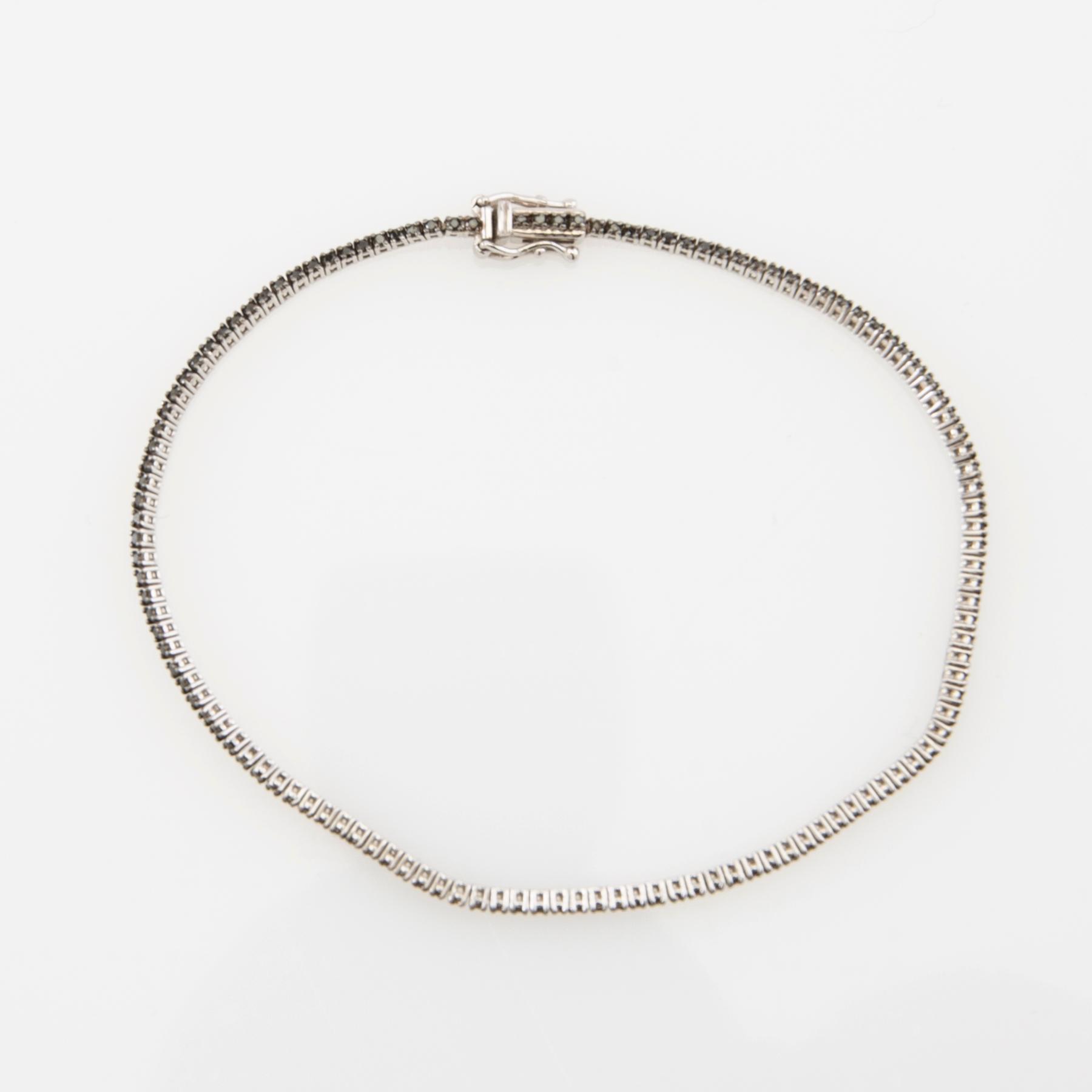 Tennis bracelet 18K white gold with black diamonds.
