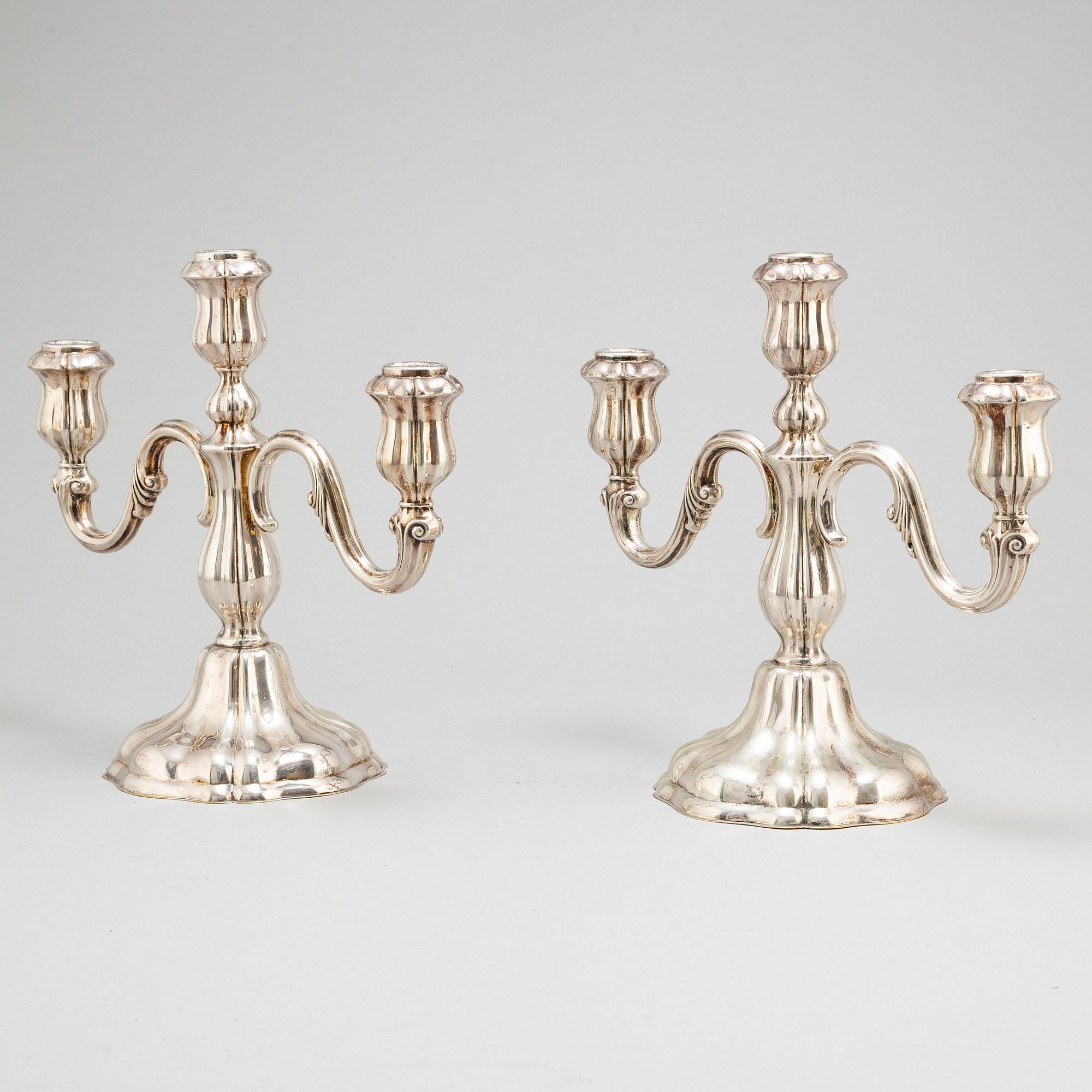 a pair of silver candelabras by K Andersson Gothenburg 1938.