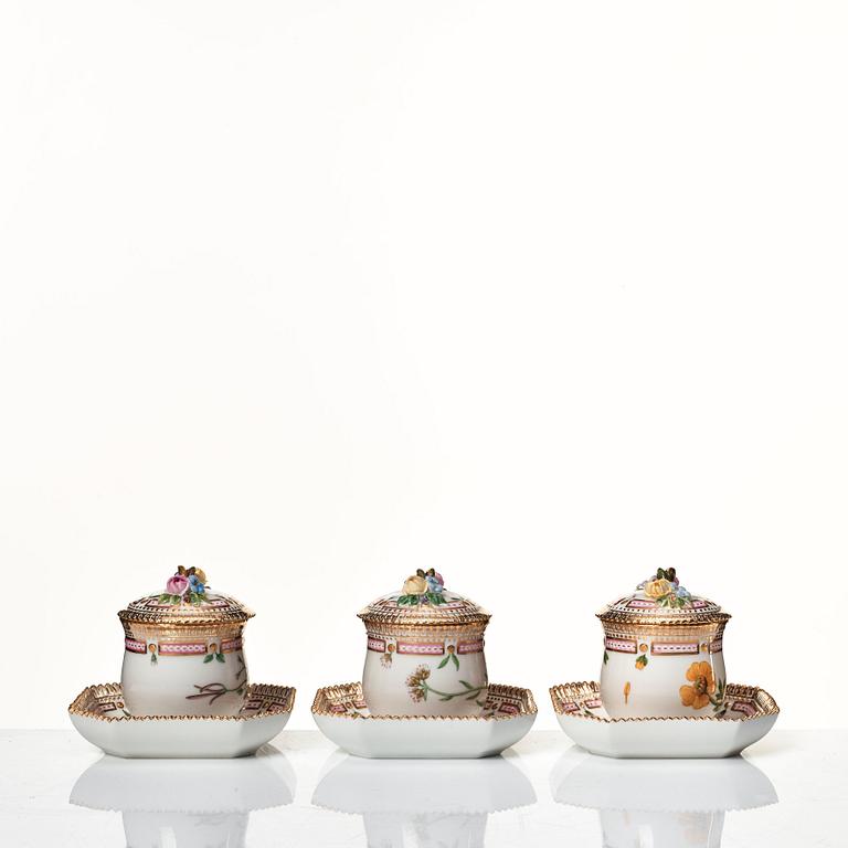 A set of 12 Royal Copenhagen 'Flora Danica' custard cups with covers and stands, Denmark, 20th Century.