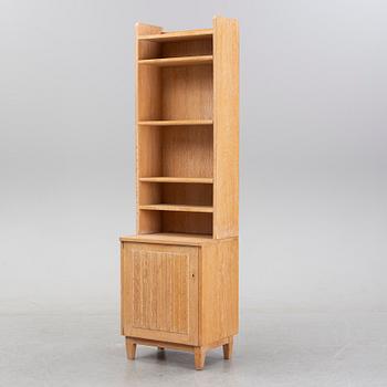 An oak book case with a cabinet, second half of the 20th Century.