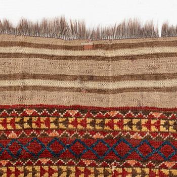 An antique Beshir carpet, ca 495 x 206 cm, around the year 1875.