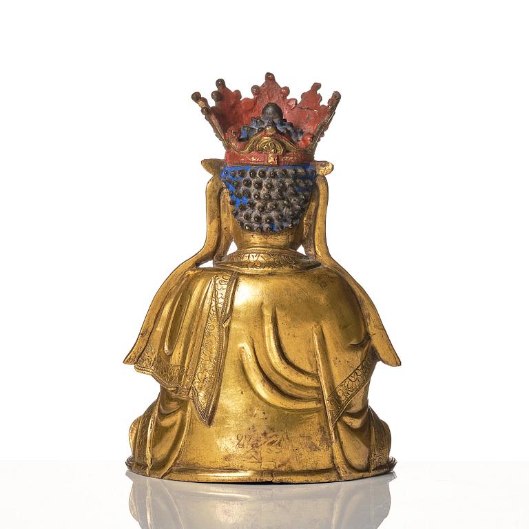A gilt-bronze figure of Vairochana, Ming dynasty (1638-1644).