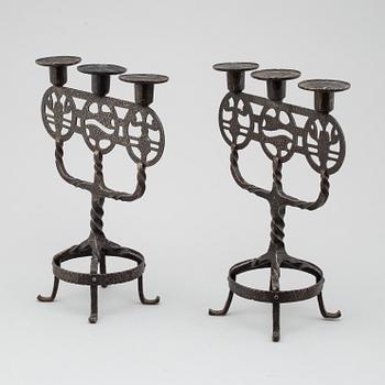 A pair of 1920s/1930s iron candelabres.