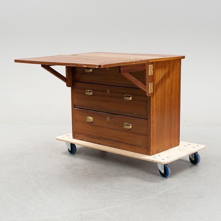 A mahogany veneered chest of drawers with tilt-top, first part of the 20th Century.