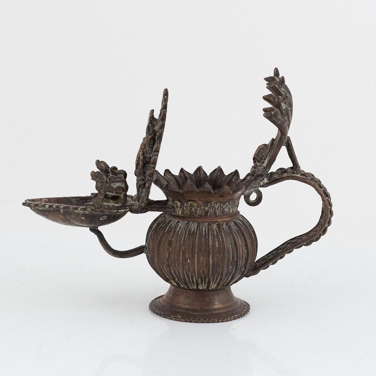 A group of three Indian bronze figures and an ewer, 20th century.