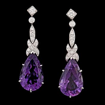 1381. A drop cut amethyst and brilliant cut diamond earrings.