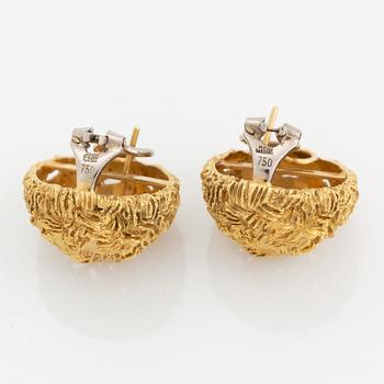 A pair of 18K gold earrings.