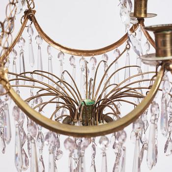 A Gustavian gilt brass and cut glass four-light chandelier, Stockholm, late 18th century.