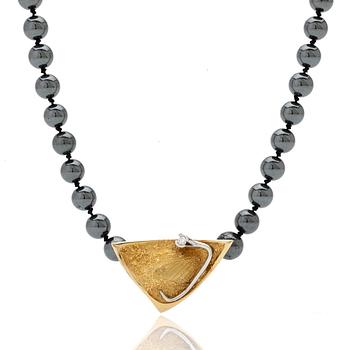 Ole Lynggaard, Hematite necklace with an 18K gold clasp and a diamond.