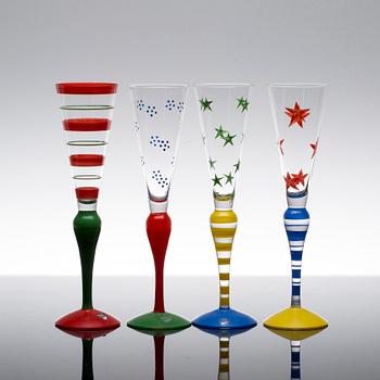 A SET OF 4 "CLOWN"  CHAMPAGNE GLASSES BY ANNE NILSSON ORREFORS.