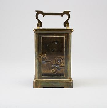 An early 20th century brass and glass carriage clock.