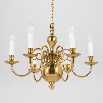 A six-arm brass chandelier, last quarter of the 20th-century.