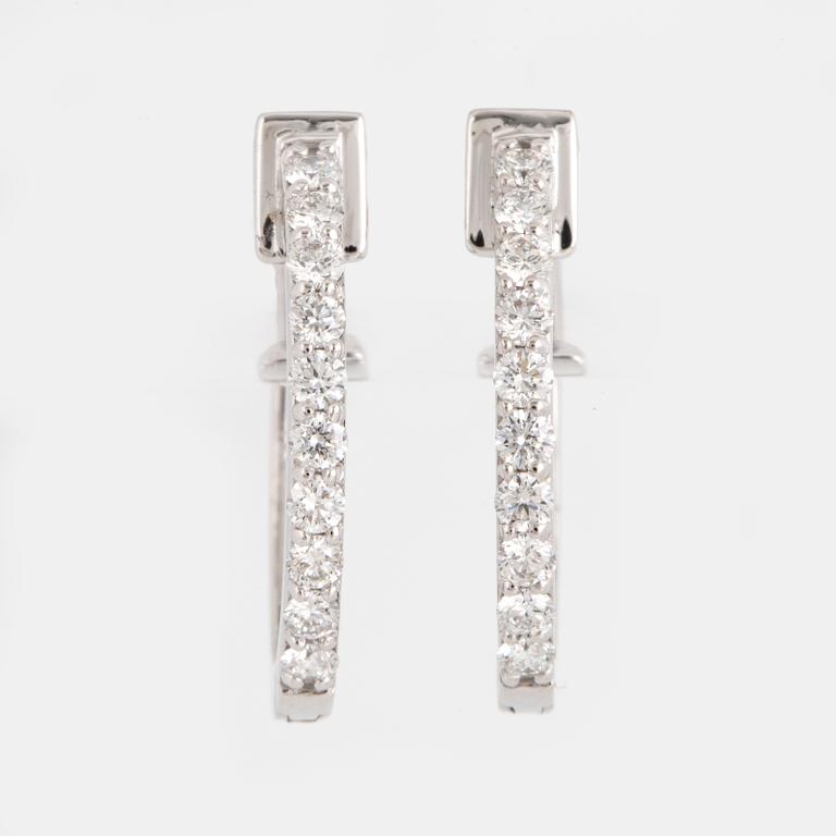 Brilliant-cut diamond hoop earrings.