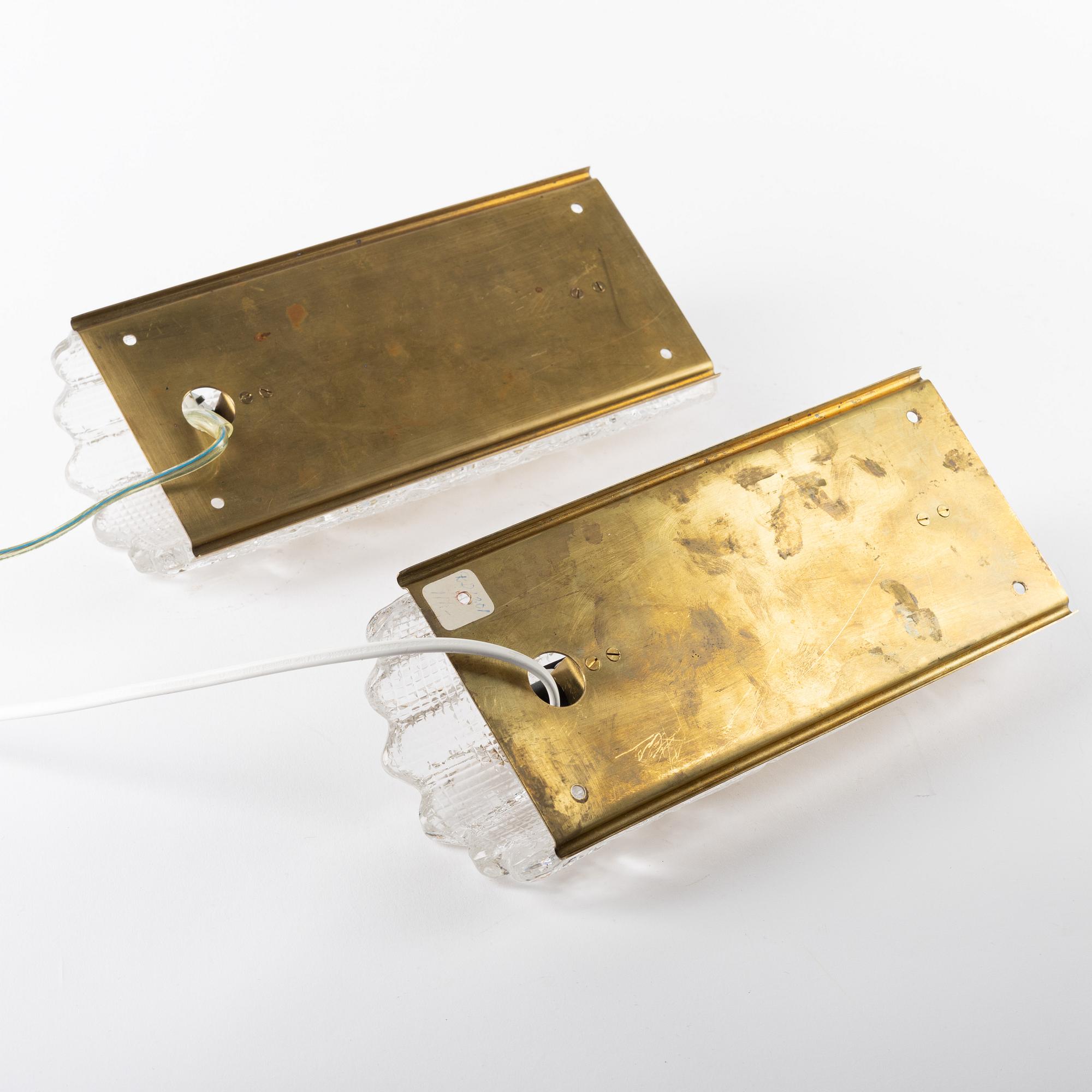 Carl Fagerlund, a pair of glass and brass wall lights, Orrefors, 1960s.