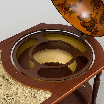 A globe shaped drinks cabinet, circa 2000.
