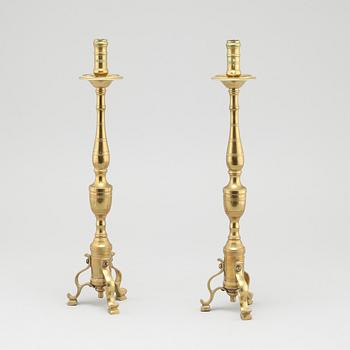 A pair of brass candlesticks, made around year 1900.