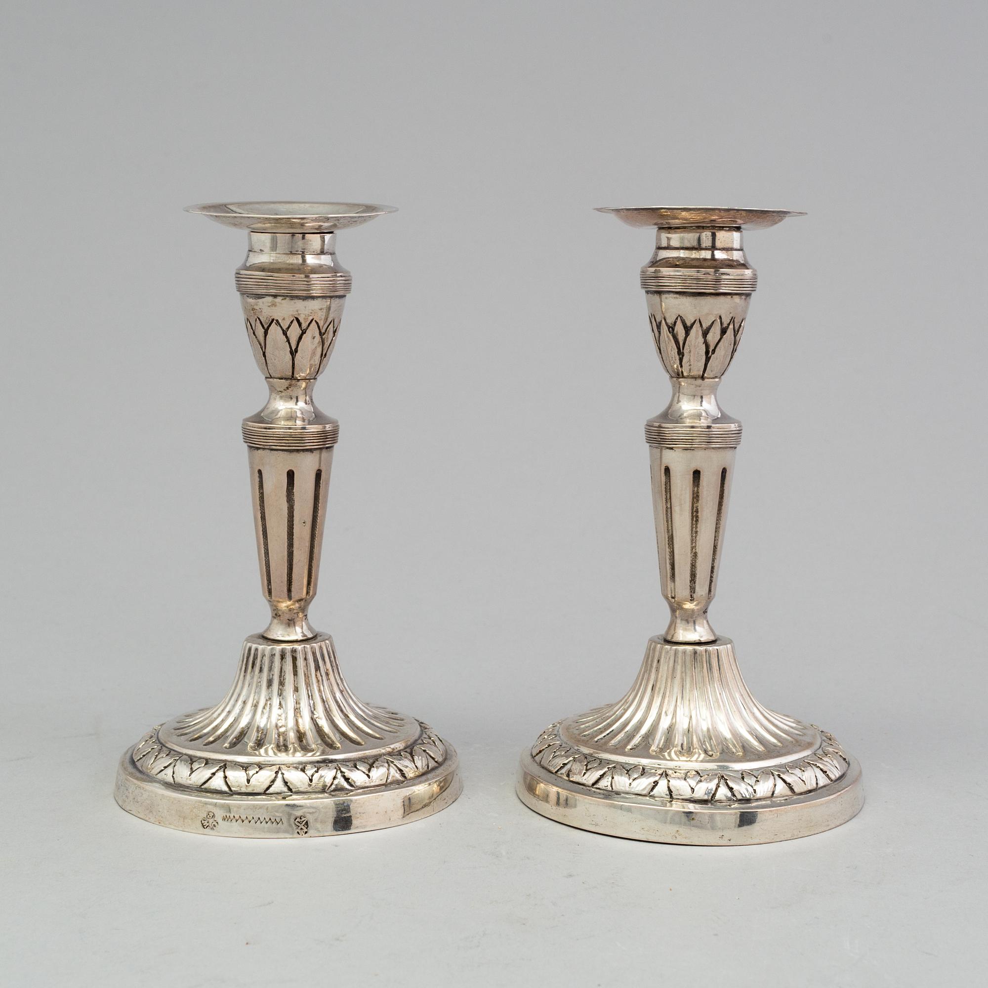 A pair of late 18th century silver candlesticks with unclear hallmarks, possibly from Germany. Weight ca 316 grams.