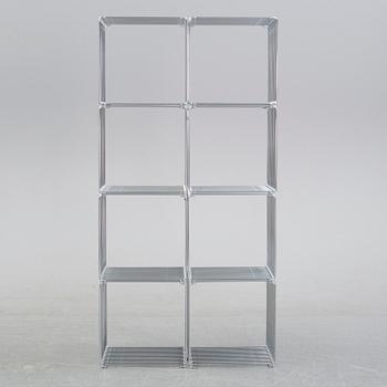 A 'Panton wire' shelving system by Verner Panton for Montana.