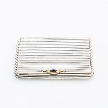 Cigarette case of silver with a cabochon-cut blue stone, first half of the 20th century.