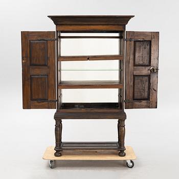 A Baroque style cabinet on later stand, first part of the 18th Century.