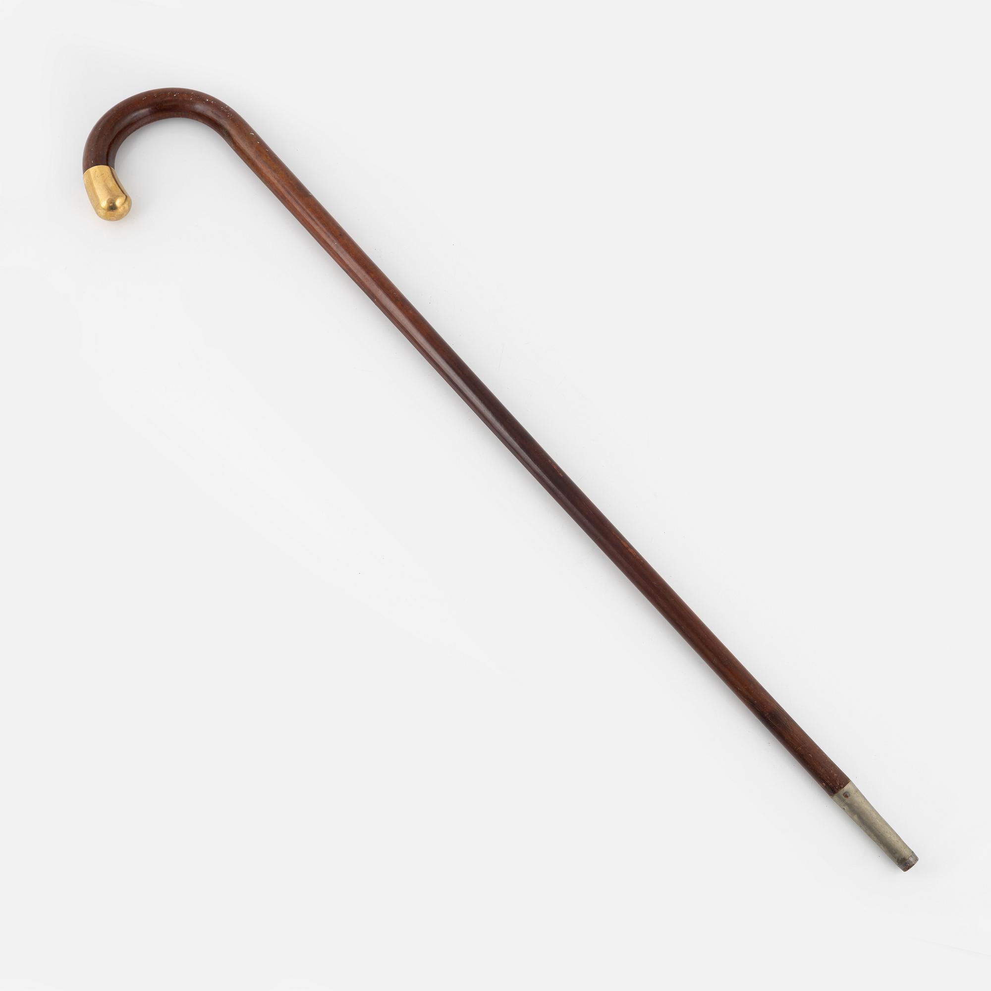 Walking stick, made of wood with upper part 18K gold.