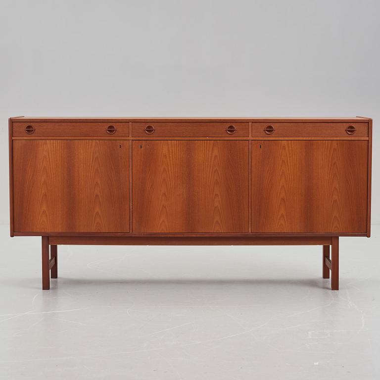 A late 20th Century teak veneered sideboard.