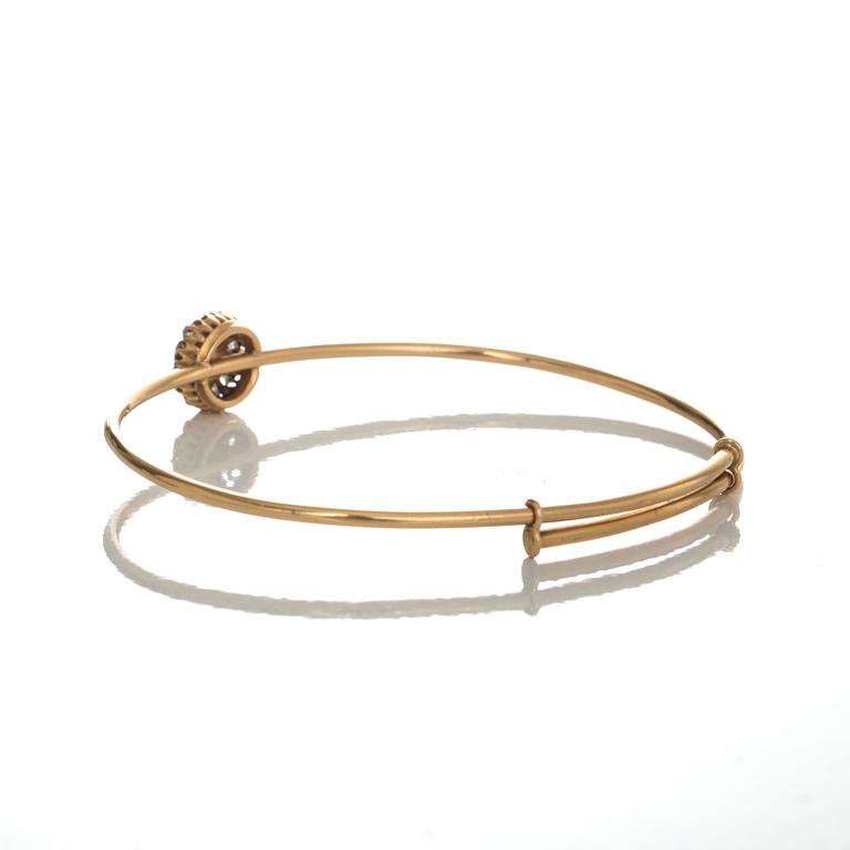 ARMRING, 18 k guld med odlad pärla samt rosenslipade diamanter. Dahlgren, Malmö, 1920. Vikt ca 12 g.